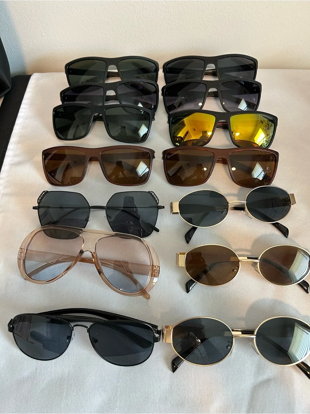 14 pairs of mixed style sunglasses. All new.